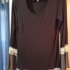 Cleste pull over light weight long top. Black and gray and in beautiful conditio